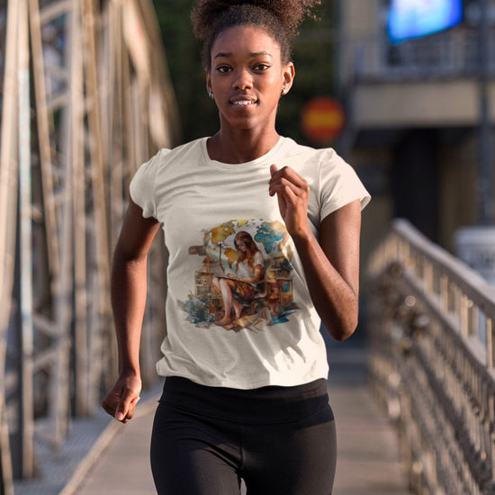 A woman jogs along a metal bridge, donning a white Wanderlust Workspace Tee featuring a vibrant graphic and black leggings. Her expression is focused, her curly hair neatly tied back. The urban buildings behind suggest an eco-friendly cityscape, sunlight emphasizing her athletic form as she embraces the wanderlust lifestyle.